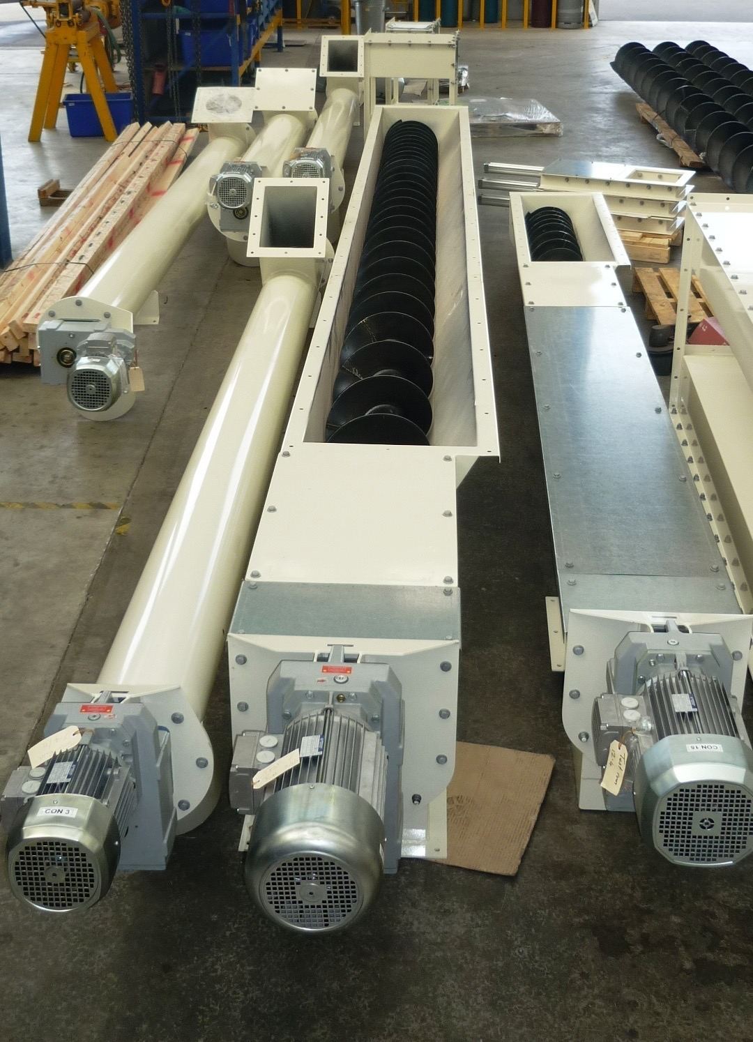 Screw conveyors fabricated by RG Steel Crafts, flight detail visible
